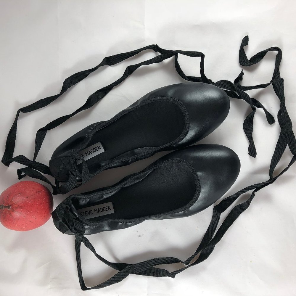 Black ballet flats in size 11M with ribbon ankle straps.